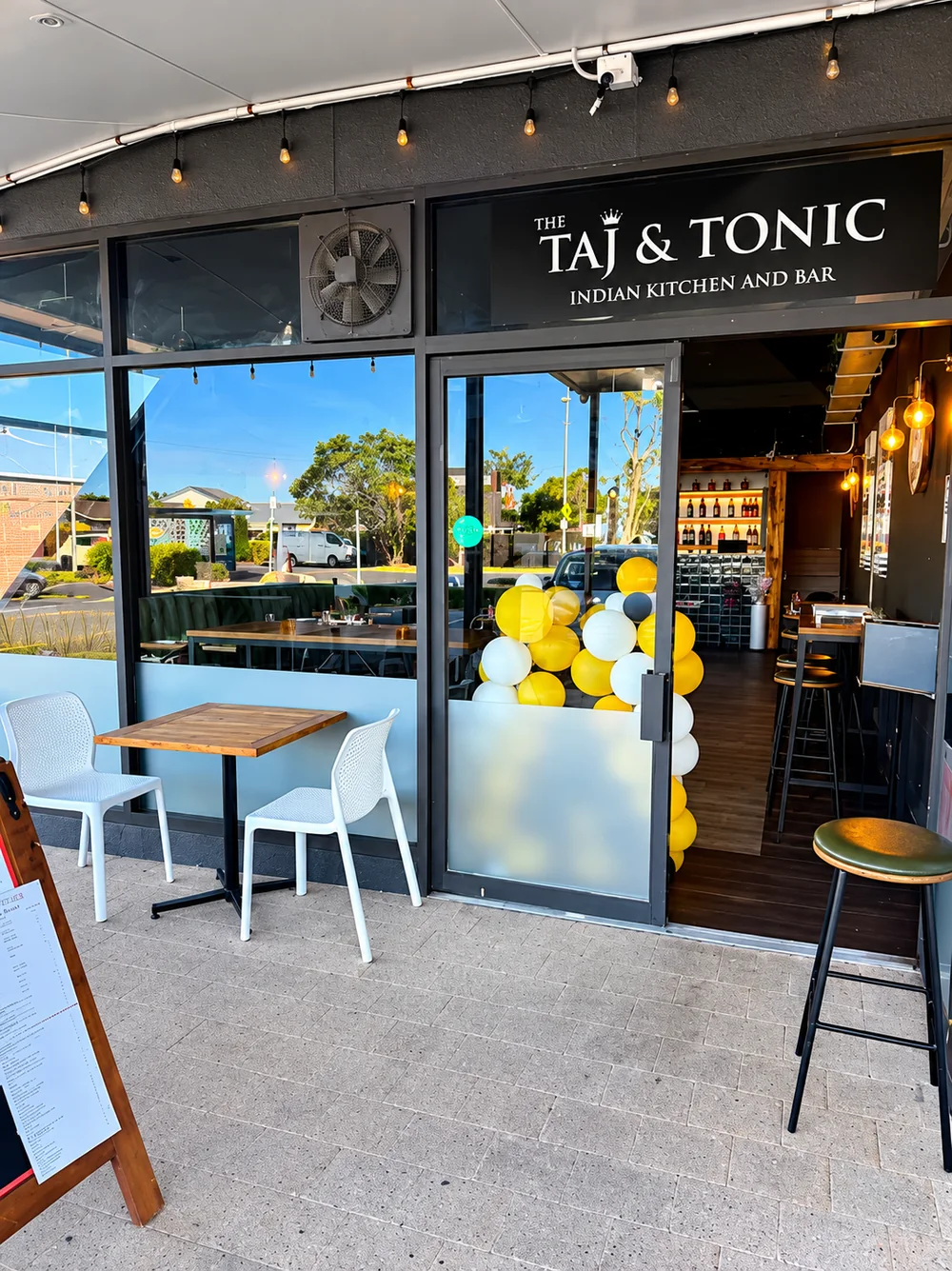 Taj & Tonic restaurant entrance and outdoor seating